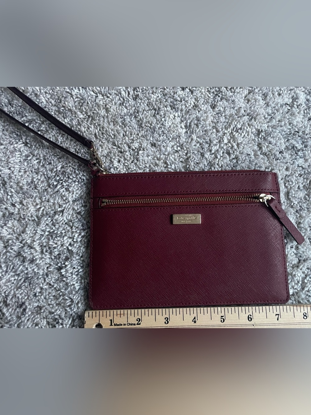 kate spade burgundy leather wristlet with gold hardware